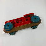 Antique wooden toy train with tin wheels