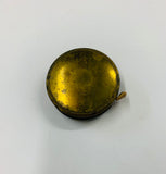 Vintage brass tape measure