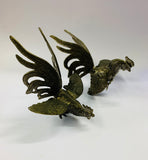 Pair of vintage metal fighting roosters