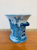 Blue and white ceramic castle scene vase