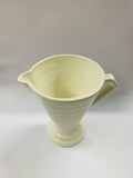 White hand potted beehive style jug