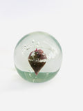 Light Grey Paperweight with Purple design in the center of a Ring of Bubbles