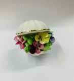 Royal Doulton china flowers in a shell