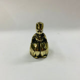 Small brass bell in the shape of a lady