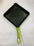 Vintage cast iron and green enamel fry pan