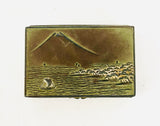 Metal Tin or a Sea Scape (maybe Rangitoto Island with a sail boat)