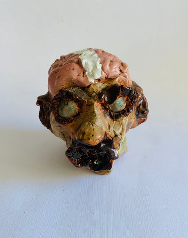 Grotesque pottery head