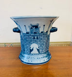 Blue and white ceramic castle scene vase