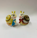 Pair of vintage novelty snail salt and pepper shakers