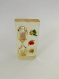 Vintage resin hour glass with flowers inside