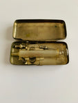 Antique medical surgical syringe in a metal case