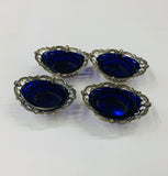 Set of 4 Sterling Silver salt pits with blue glass liners