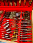 44 piece brass and teak wooden handled cutlery set