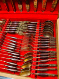 44 piece brass and teak wooden handled cutlery set