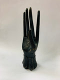 Black wooden hand