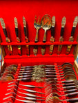 44 piece brass and teak wooden handled cutlery set