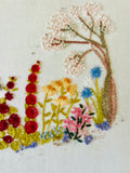 Framed Embroidery of a Garden in Bloom