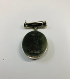 Sterling Silver and Paua Tiki brooch