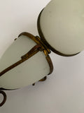 Ornate Victorian milk glass egg in brass wire stand jewellery holder