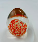 Egg Shaped Paperweight with Orange and White Dots