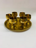 Brass tray with 6 small brass liqueur glasses