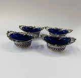 Set of 4 Sterling Silver salt pits with blue glass liners
