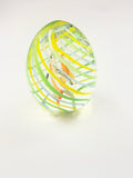 Clear Paperweight with Internal Amber Piece with Twisted Green and Yellow Outer Shell