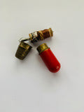 Red and brass needle and thread case