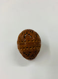 Carved coquilla nut egg shape case