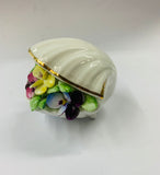 Royal Doulton china flowers in a shell