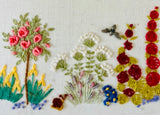 Framed Embroidery of a Garden in Bloom