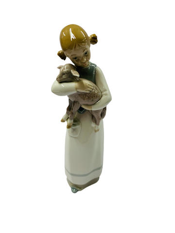 Lladro girl holding a baby goat
