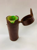 4 mottled Bakelite cups in a leather case