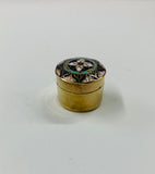 Antique brass pill box with enamel design lid