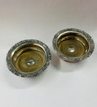 Pair of antique ornate silver plated over copper wine bottle coasters