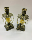 Pair of ornate antique candlesticks