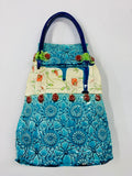 Katie Gold ceramic handbag