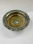 Pair of antique ornate silver plated over copper wine bottle coasters
