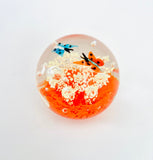 Clear Paperweight with Two Butterflies flying over white swirls