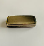Antique medical surgical syringe in a metal case