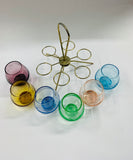 Retro multi coloured shot glass set in spinning metal holder