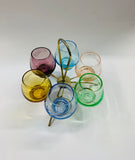 Retro multi coloured shot glass set in spinning metal holder