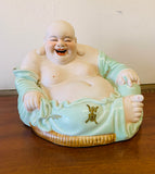 Large seated laughing ceramic Buddha statue