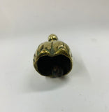 Small brass bell in the shape of a lady
