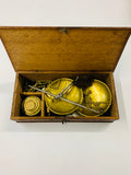 Antique gold weighing scales in box with weights