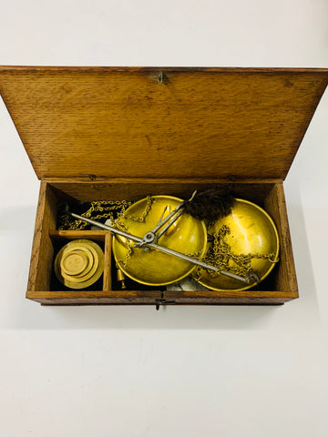 Antique gold weighing scales in box with weights