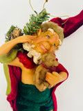 Whimsical Christmas Elf Holding a Teddy Bear