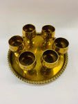 Brass tray with 6 small brass liqueur glasses