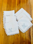 Set of Six Cream Napkins with Scolloped Edges and Grey Embroidery