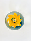 Clear Paperweight with Blue Base and Orange Swirl Flower